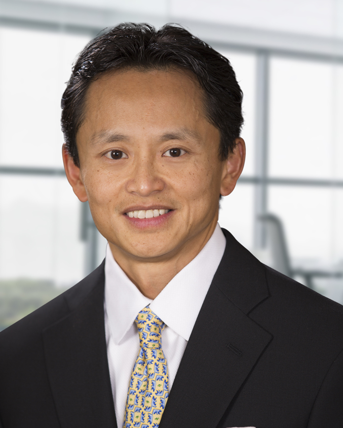 Headshot of Managing Partner David Hinsley Cheng in a suit and tie